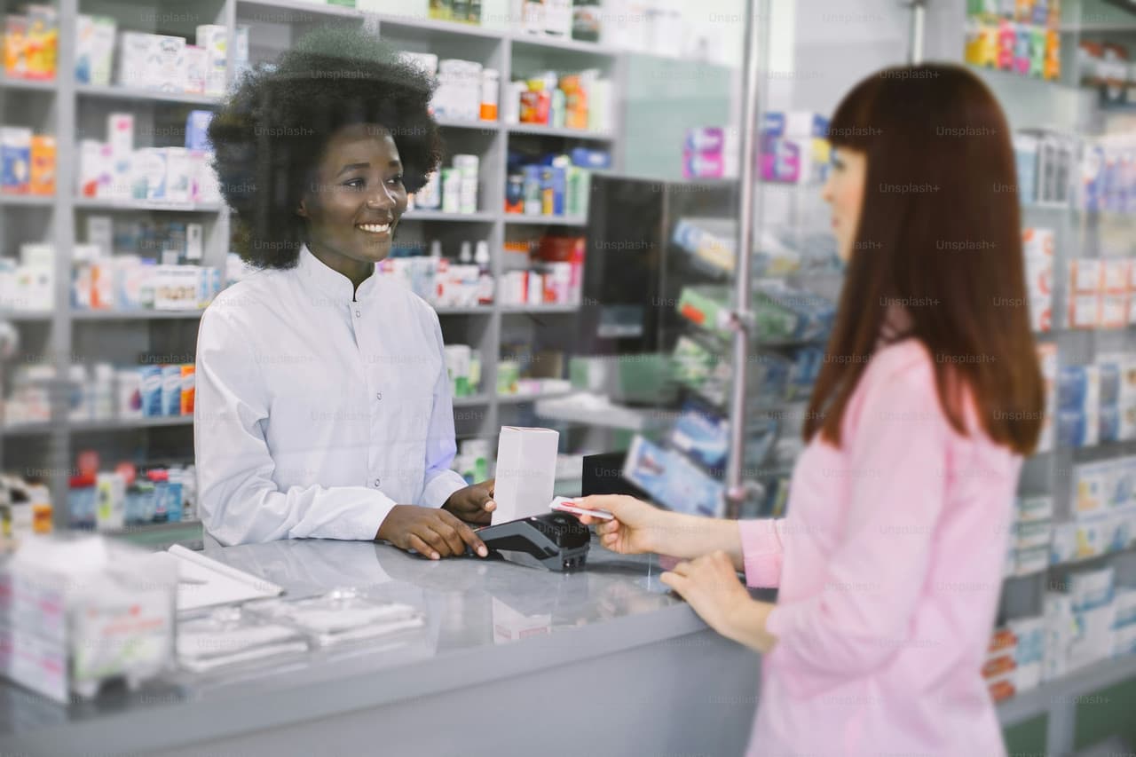 Pharmacy professional assisting customer